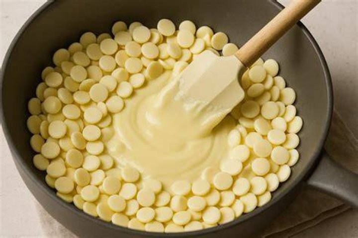 Chocolate Covered Pretzels are fast, easy and delicious! A perfect sweet and salty treat that's perfect for parties, holidays or any special occasion. Melting white chocolate chips and dipping pretzels.