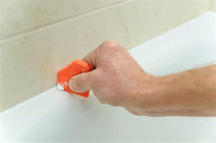 removing caulk from tub